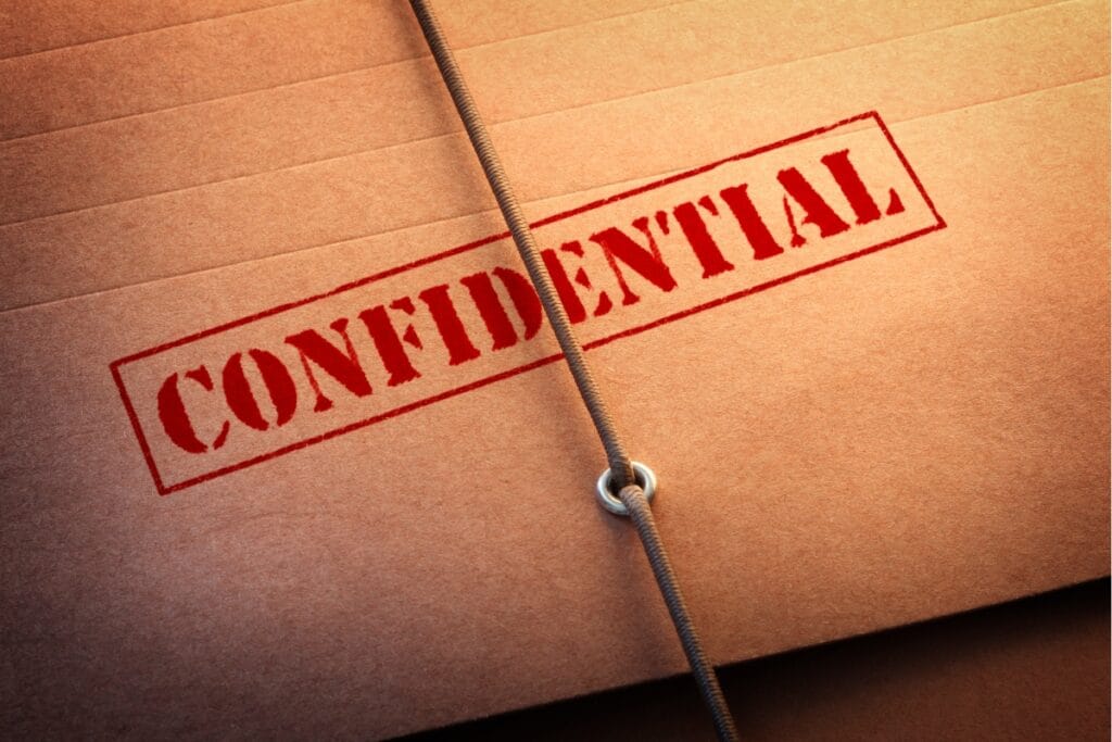 A brown envelope, sealed with string and stamped "CONFIDENTIAL" in red, stands as a testament to corporate security.