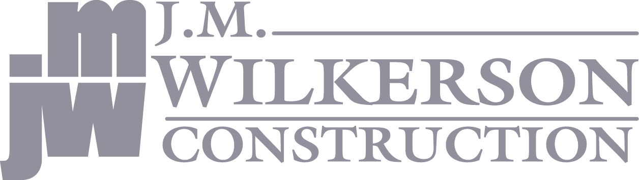 Gray logo for J.M. Wilkerson Construction featuring stylized “JM” and “JW” letters on the left, with the company name in uppercase text to the right—designed to inspire trust in construction, investigation, and security services.