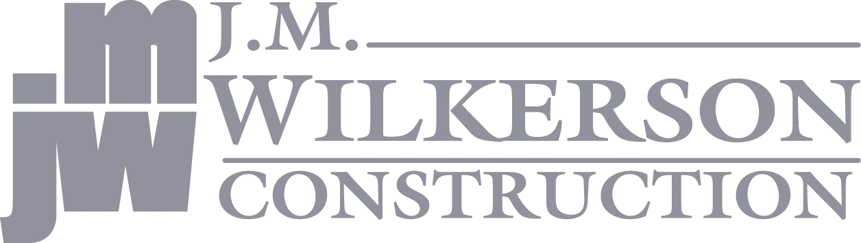 Gray logo for J.M. Wilkerson Construction featuring stylized “JM” and “JW” letters on the left, with the company name in uppercase text to the right—designed to inspire trust in construction, investigation, and security services.